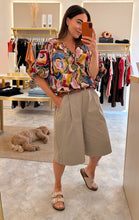 Load image into Gallery viewer, MOSAIC TIE FRONT BUBBLE HEM BLOUSE
