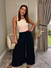 Load image into Gallery viewer, BLACK PLISSÉ PALAZZO TROUSERS