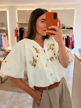 Load image into Gallery viewer, EMBROIDERED TIE FRONT BUBBLE HEM BLOUSE
